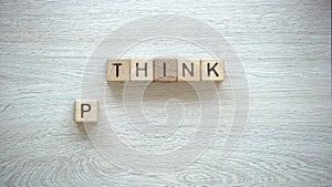 Think positive phrase made of cubes, psychological help to fight insecurities