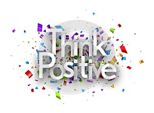 Think positive sign on colorful cut ribbon confetti background