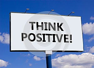 Think positive symbol. Concept words Think positive on beautiful big white billboard. Beautiful blue sky cloud background.