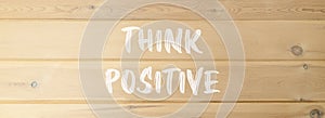 Think positive symbol. Concept words Think positive on beautiful wooden wall. Beautiful wooden wall background. Business,