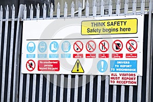 Think safety sign board at construction building site entrance