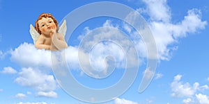 Thinker angel above the clouds on a blue sky background: greeting card for christmas, baptism or communion