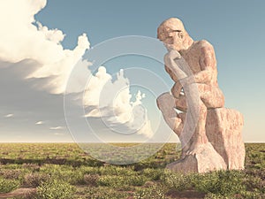 Thinker sculpture in a landscape