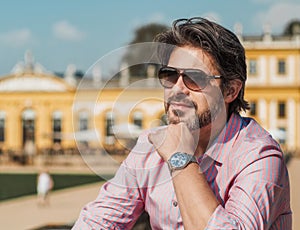 Thinkful good looking adult man. Close-up of gorgeous businessman