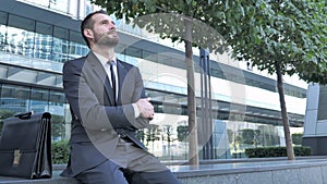 Thinking Beard Businessman Ouside Office