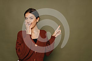 Thinking beautiful young woman looking to the side at green copyspace. Funky caucasian smiling and joyful.