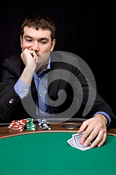 Thinking before bet in casino photo