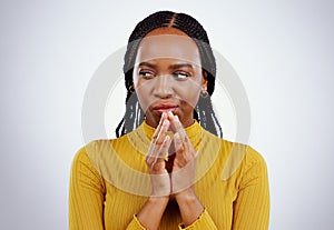 Thinking, black woman and scheme hands in studio for evil, planning or revenge on grey background. Plotting, villain and