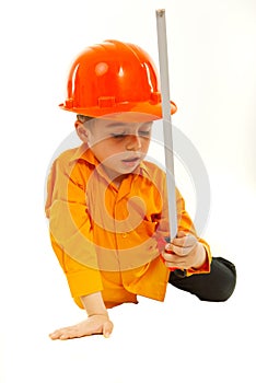 Thinking boy holding measure tool