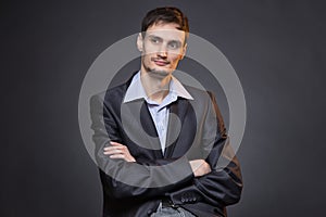 Thinking businessman with arms crossed