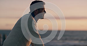 Thinking, calm and at peace man looking at the ocean or sea view on sunset beach with copy space background. Mature guy