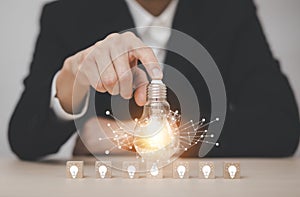 Thinking and creative concept, Close up the light bulb and working on the desk, Creativity, and innovation are keys to success,  n