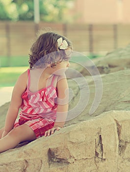 Thinking cute kid girl looking on