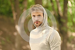 Thinking about future achievements. Man bristle confident face, nature background, defocused. Man with beard or unshaven