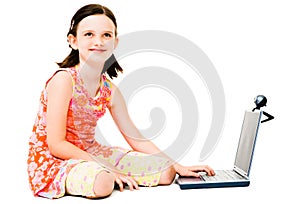 Thinking girl using a laptop