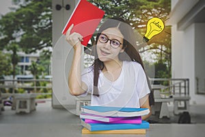 Thinking idea student girl with glasses and books on desk, Bored