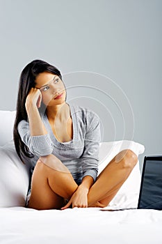 Thinking laptop woman