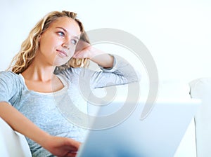 Thinking, laptop and woman on sofa for remote work, planning or dream. Computer, idea and freelance person in living