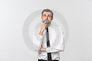 Thinking man isolated on white background. Closeup portrait of a casual young pensive businessman looking up at