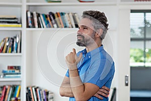 Thinking middle aged man with grey hair