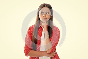 Thinking pensive clever teenager girl. Thoughtful teenage child girl on white isolated background. Portrait of a kid