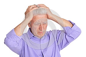 Thinking senior man isolated on white background