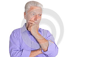 Thinking senior man isolated on white background
