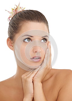 Thinking, skincare and hands on face of woman in studio with wellness, cosmetics or results on white background. Natural