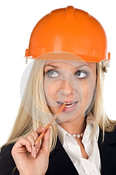 A thinking woman in hard hat