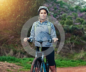 Thinking, woman and mountain bike in nature, fitness and cycling sports for adventure on path. Female person, athlete