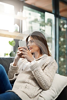 Thinking, woman and phone to relax on sofa in house with decision for conversation response or announcement by post