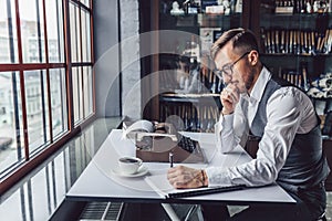 Thinking young man at work