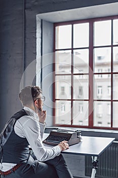 Thinking young screenwriter at work photo