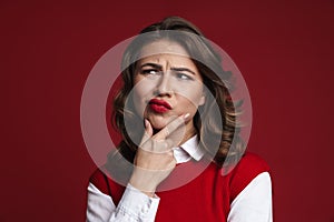 Thinking young woman posing isolated