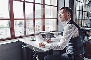Thinking young writer in the office