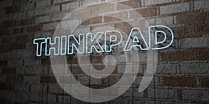THINKPAD - Glowing Neon Sign on stonework wall - 3D rendered royalty free stock illustration