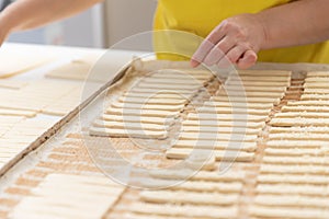 Thinly rolled and cut into strips of dough