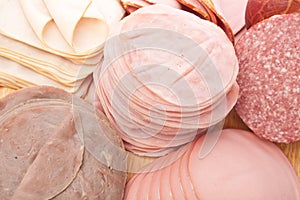 Thinly Sliced Meats on White Background