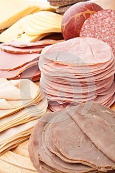 Thinly Sliced Meats on White Background