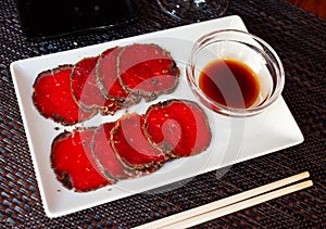 Thinly sliced raw beef sashimi