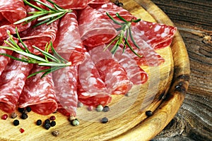 Thinly sliced salami, delicious snack rustic salami on table