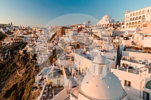 Thira, Greece - 11.07.2021: Santorini white architecture village top view.