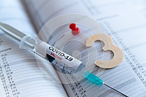 Third covid vaccine dose and jab concept. Three syringes are seen on calendar as a concept for the 3rd covid-19 vaccine dose, also