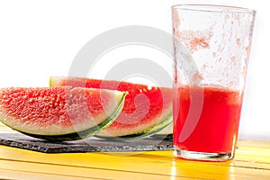 Thirst quenching healthy summer fruit drink. Refreshing watermelon slices and smoothie.