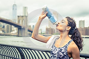 Thirsty athlete drinking after long run in New york city