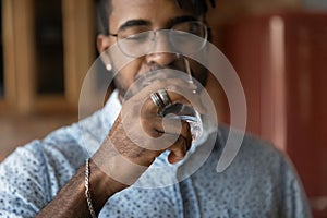 Thirsty biracial man enjoy clean mineral water