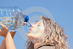 Thirsty blond woman on desert