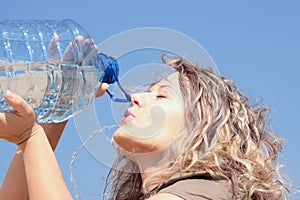 Thirsty blond woman on desert