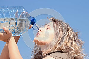 Thirsty blond woman on desert