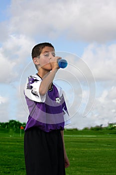 Thirsty boy drinking refreshing drink